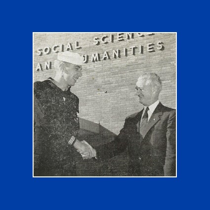 A photo from UCR's 1954 yearbook shows UCR's first student, a Navy sailor, Jim McMillan a day after his release from the U.S. Navy. He is shaking hands with with Dr. Gordon Watkins, the provost from 1949 to 1956.
