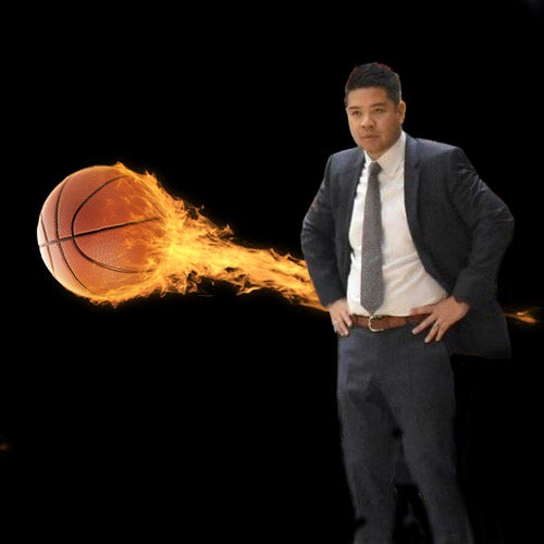 The first Division I men’s basketball head coach of Asian descent, UCR's Mike Magpayo, stands in front of a flaming basketball.