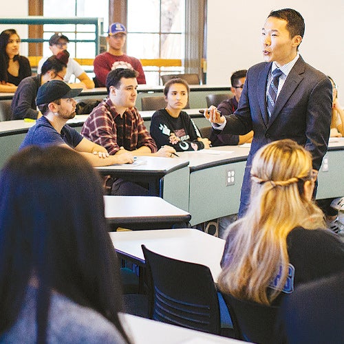 A UCR School of Business professor addresses a class on campus.