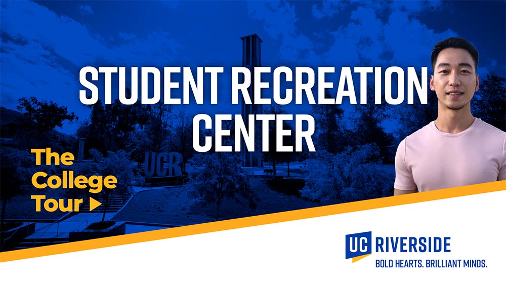 Student Recreation Center | The College Tour | Male student smiles and the UCR Bell Tower in the background