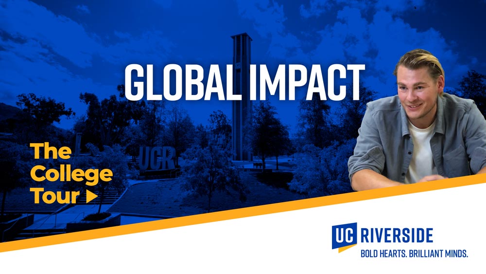 Global Impact | The College Tour | Male student smiles and the UCR Bell Tower in the background