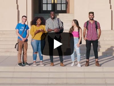 A group of UCR students, female and male, stand on the steps of building on campus. There is a video play button overlaid in the center.