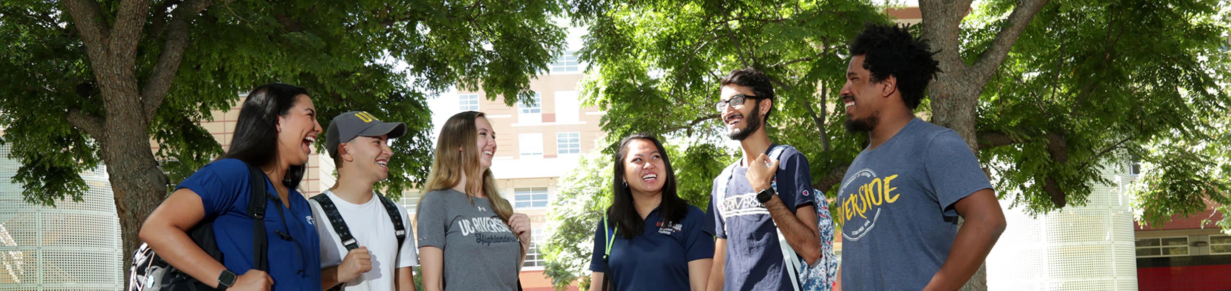 Six students in the College of Humanities, Arts, and Social Sciences gather outside