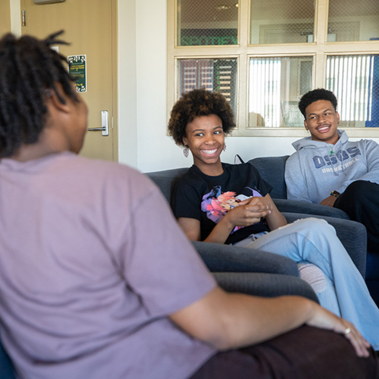 Students chat inside PATH, Pan African Theme Hall, located inside Lothian residence hall on the UC Riverside campus.