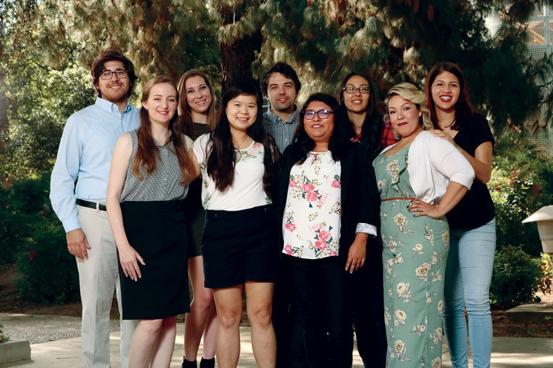 The 11 winners of the National Science Foundation Graduate Research Fellowship Program award smile for the camera