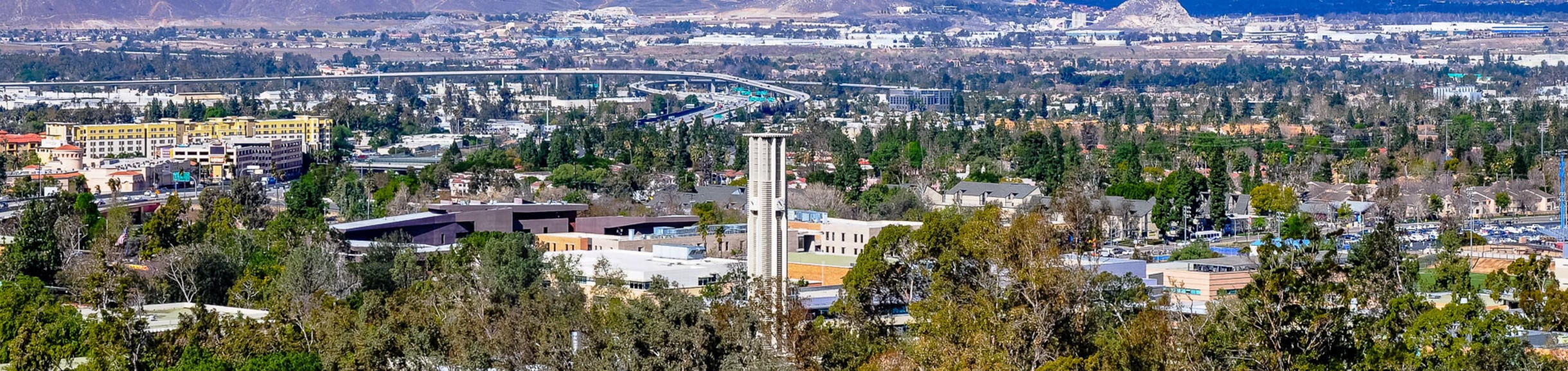 Panoramic view of UCR campus, iconic Bell Tower and surrounding City of Riverside.